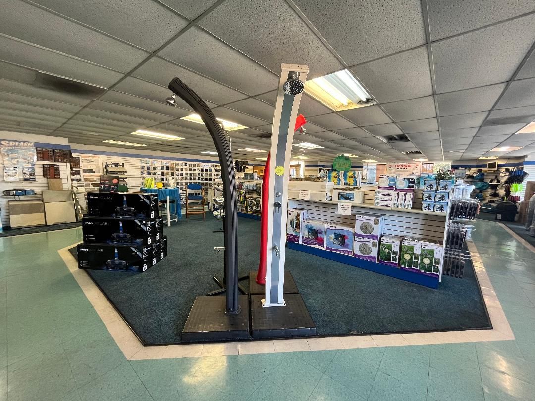 A large room with a basketball hoop in the middle of it.