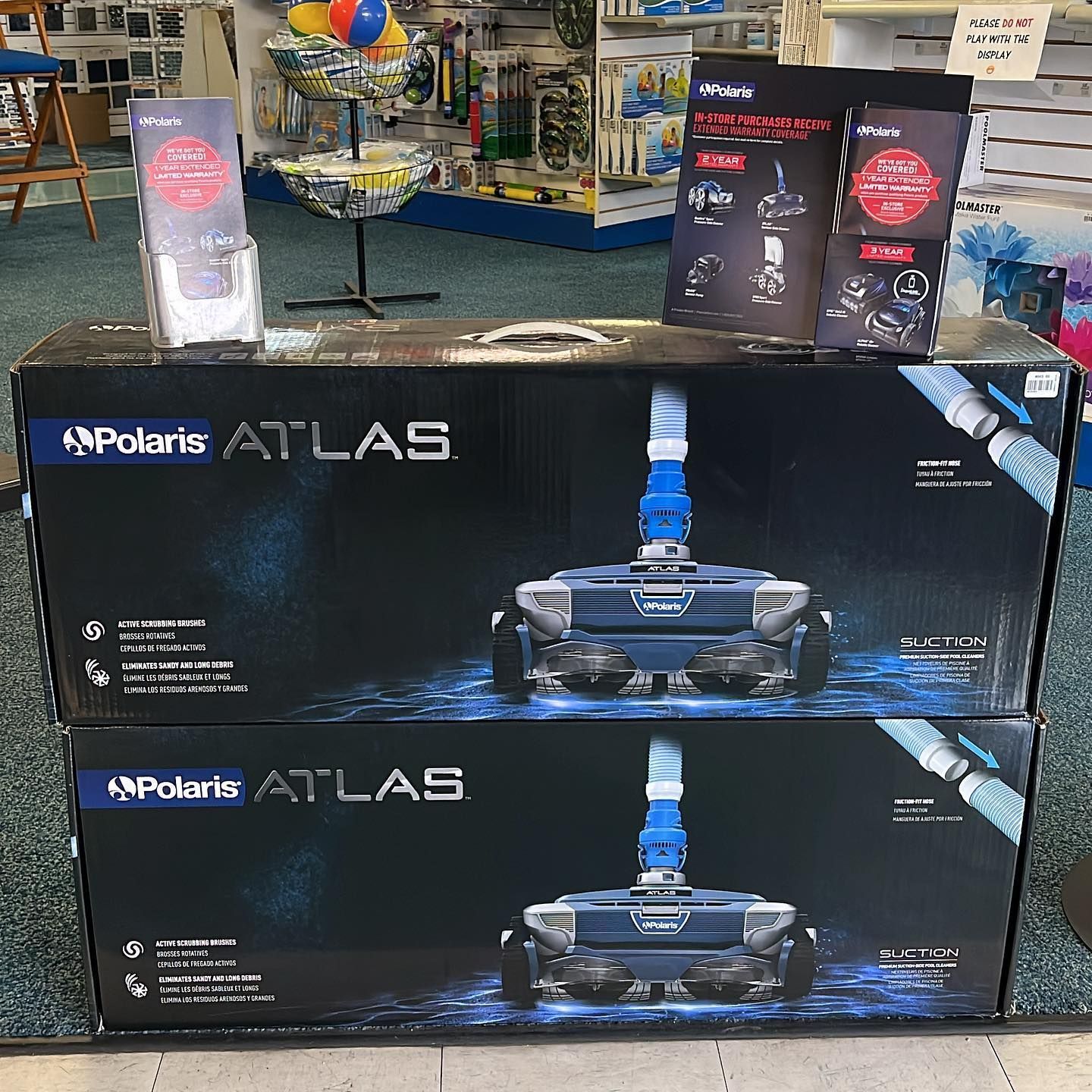 Two boxes of polaris atlas vacuum cleaners are stacked on top of each other