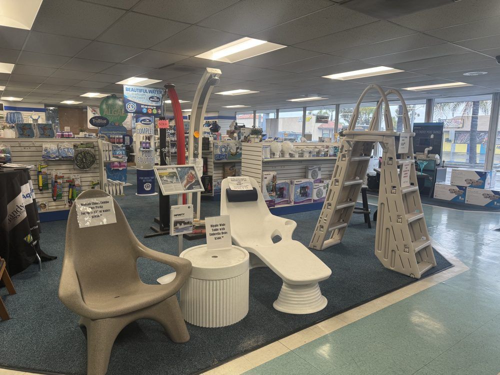 A store filled with furniture and a ladder.