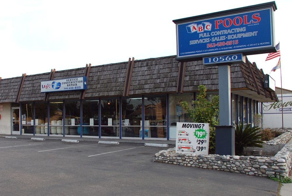 A building with a sign that says d & g pools