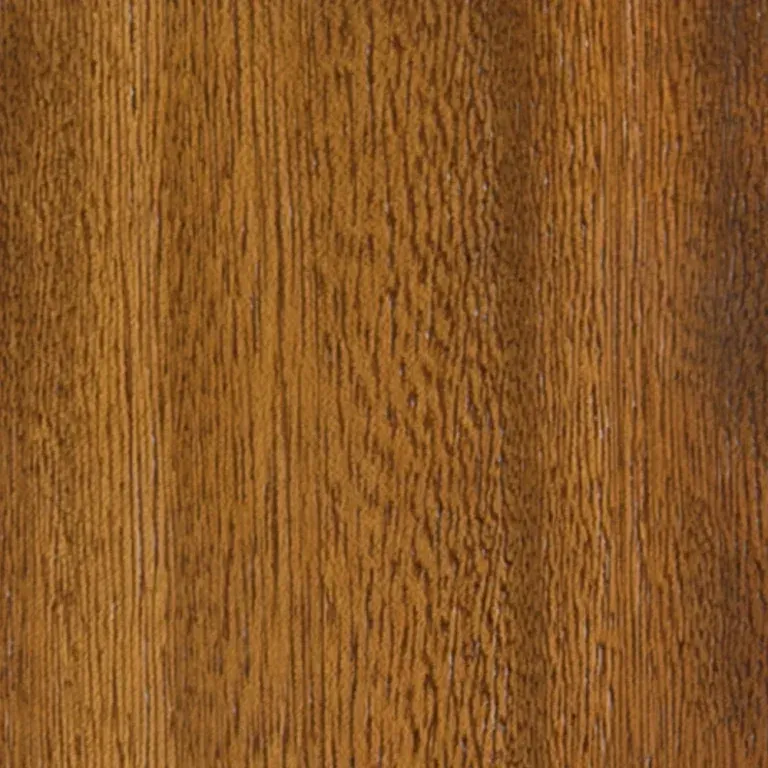 Un primo piano di un pezzo di legno che ne mostra la venatura e la consistenza.