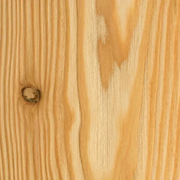 Un primo piano di un pezzo di legno con un foro.
