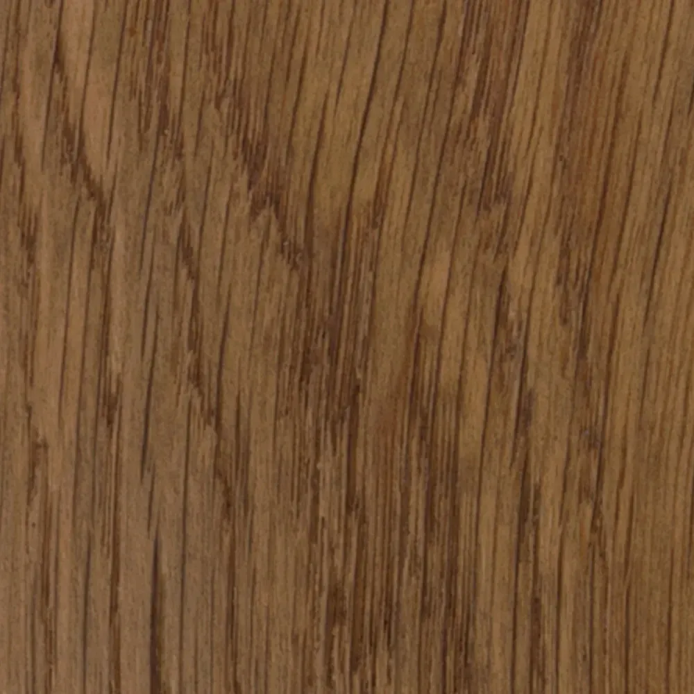 Un primo piano di un pezzo di legno che mostra la venatura del legno.