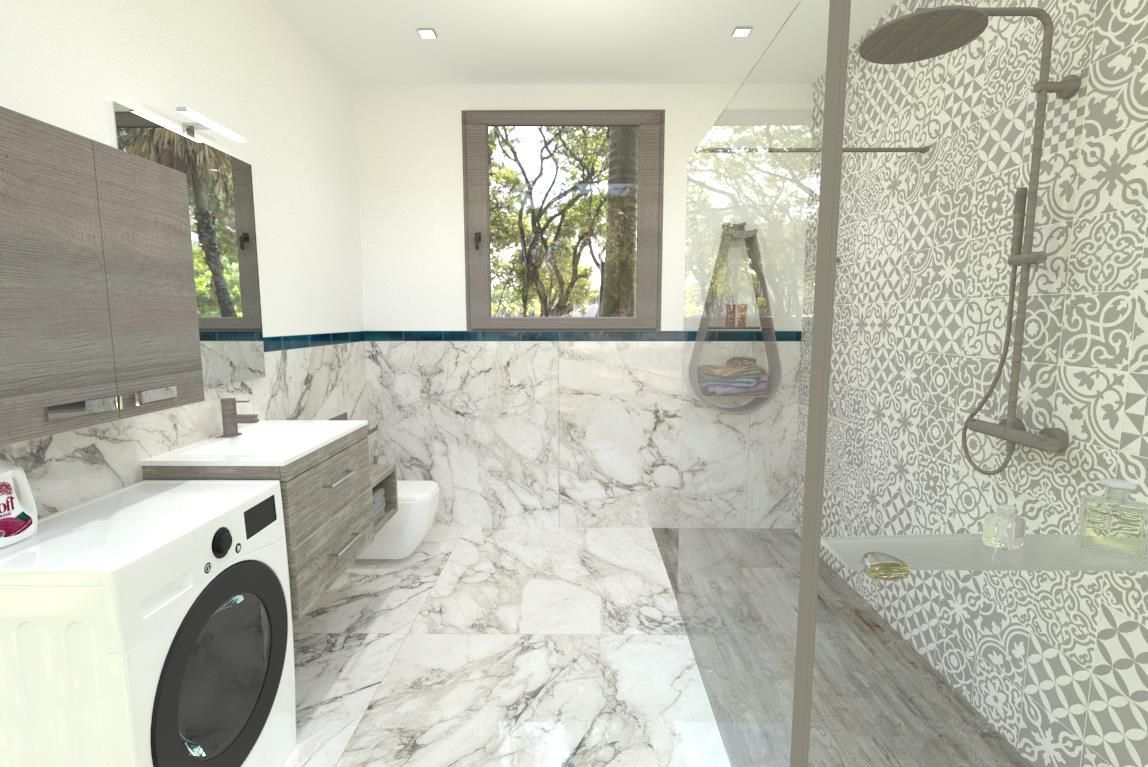 Un bagno con lavatrice, lavandino, wc e doccia.