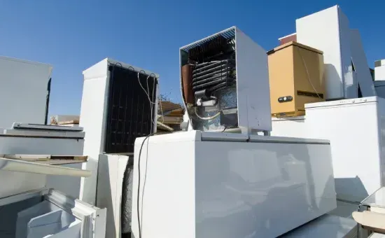 A bunch of white appliances are stacked on top of each other.