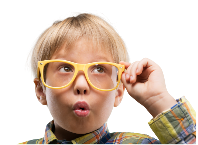 Blonde child with yellow glasses, looking upwards with a surprised expression.