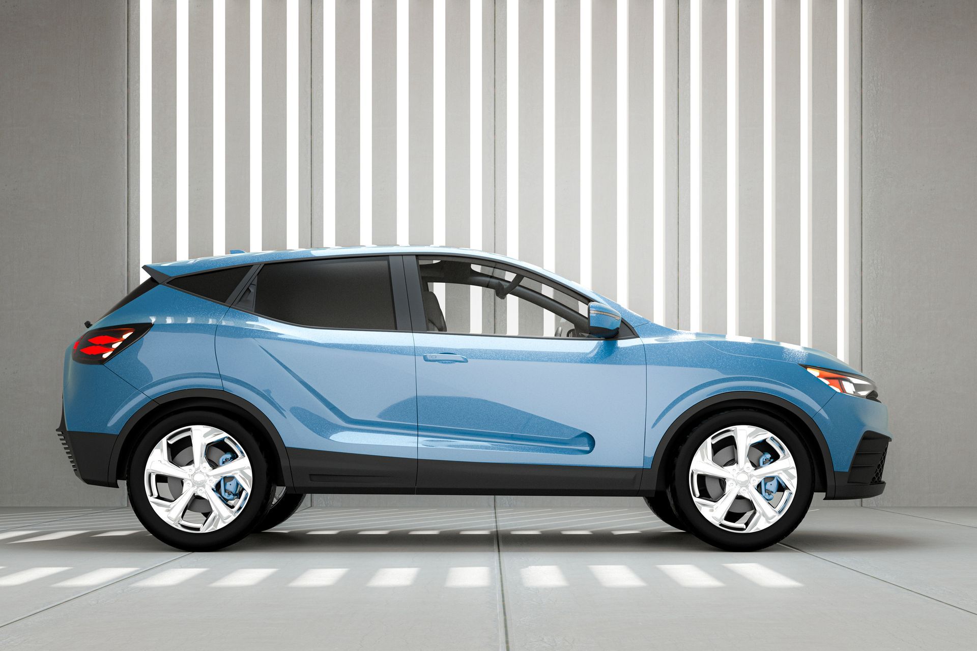 A blue car is parked in a garage in front of a white wall.