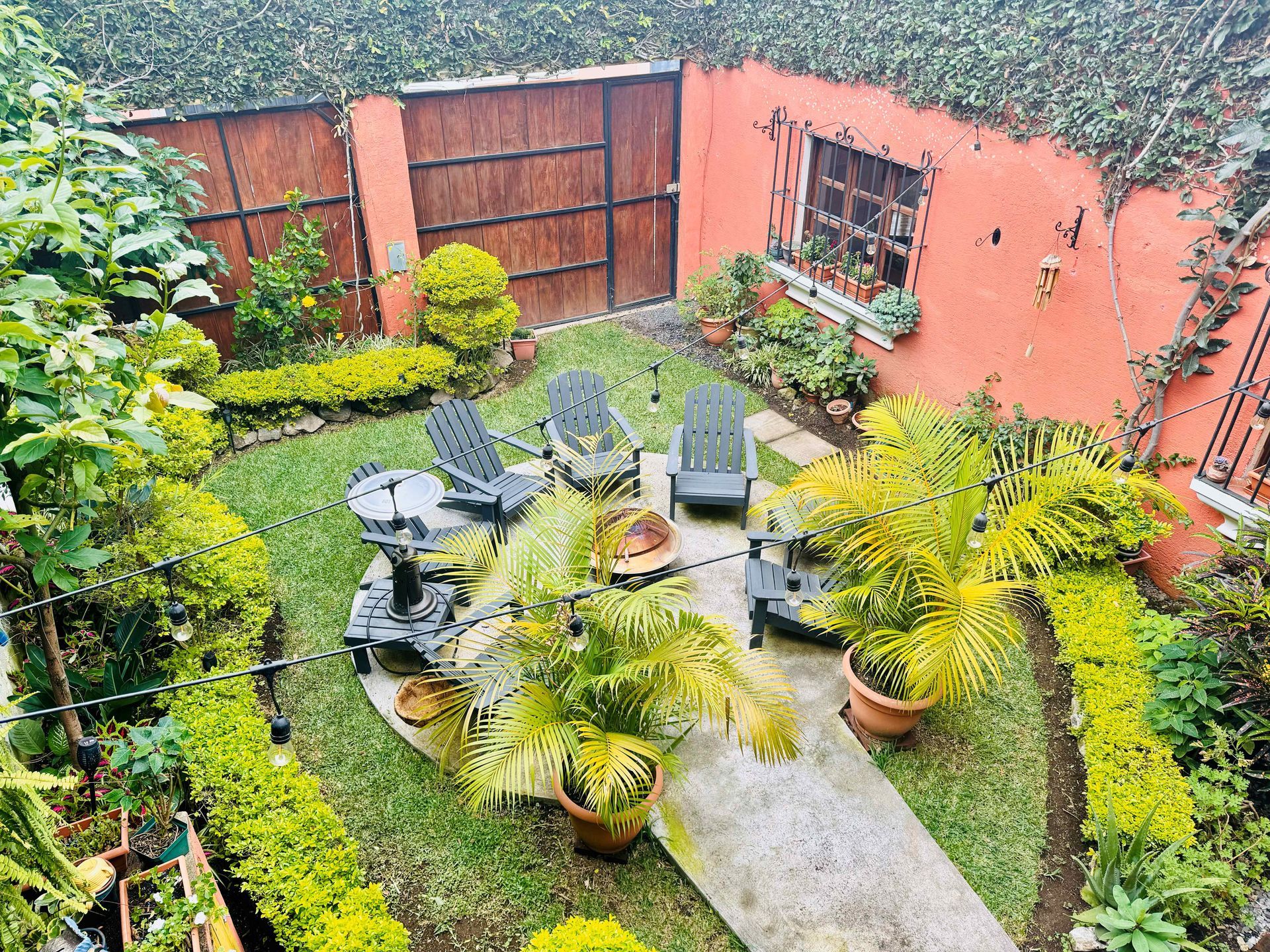 An aerial view of a garden with chairs and plants