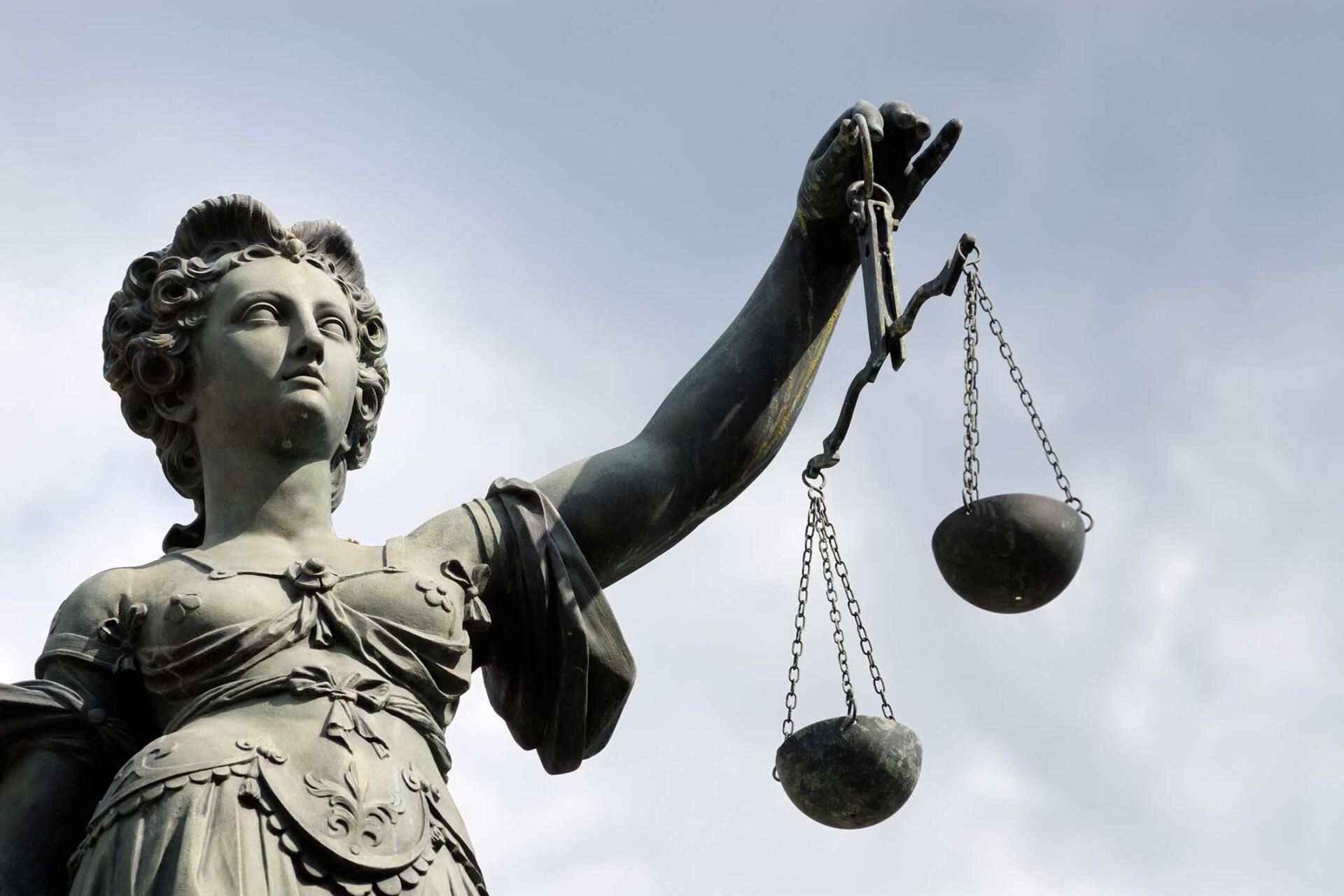Statue of Lady Justice holding scales, sky background. Statue of Lady Justice holding scales, sky background.