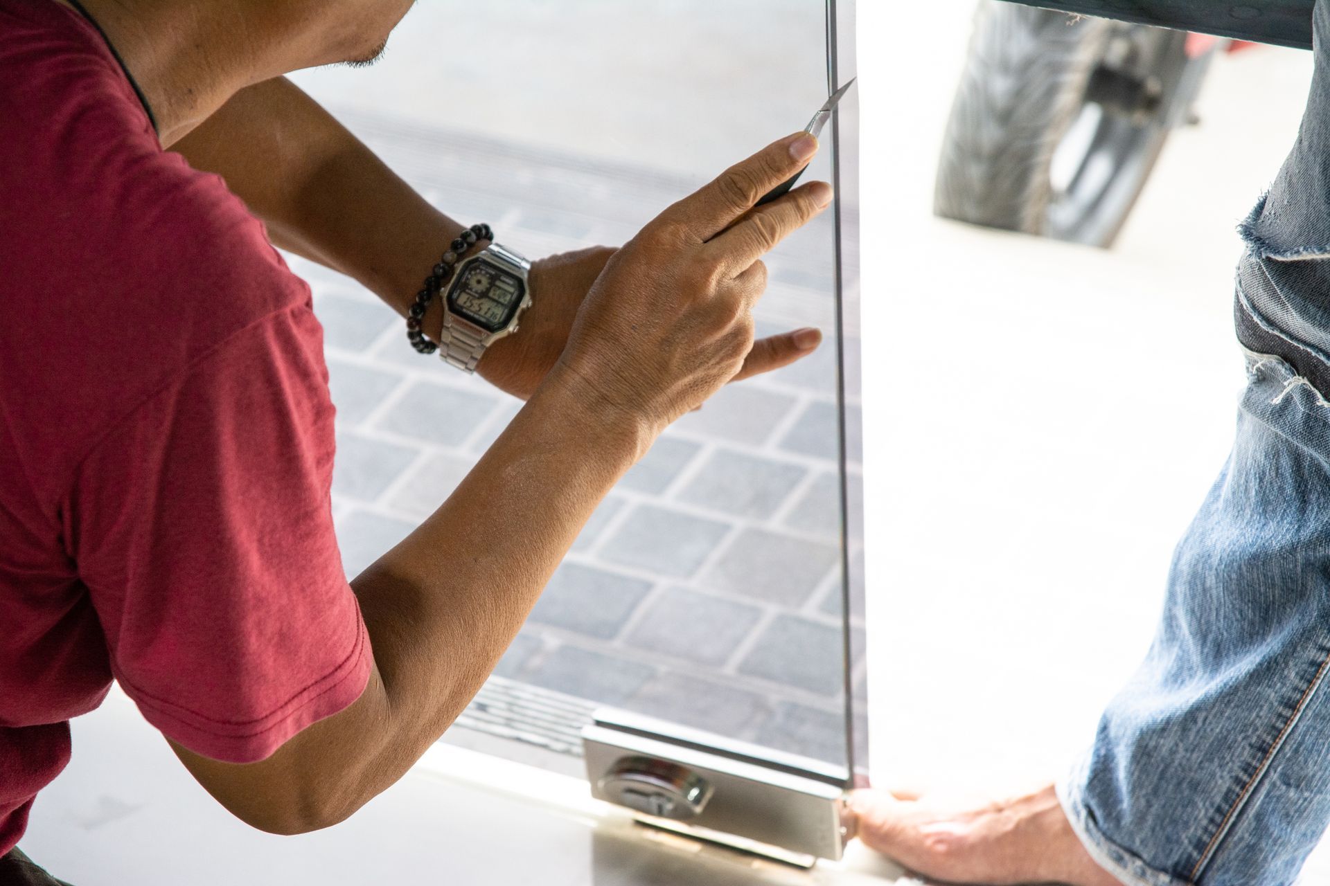 Worker install tint film for the window glass.