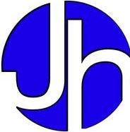 A j. henry plumbing van is parked in a gravel lot.