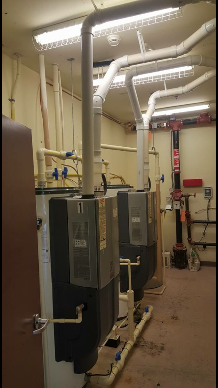 A room filled with lots of pipes and heaters.