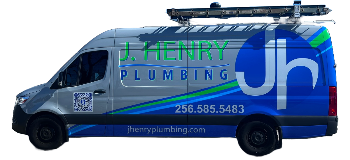 J. henry plumbing van is sitting on a white surface .