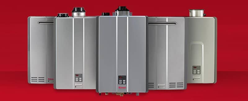A group of water heaters sitting next to each other on a red background.