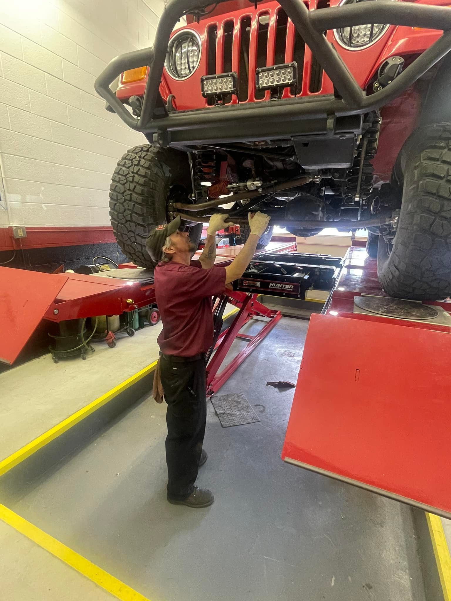 Mechanic under vehicle | The Car Doctor