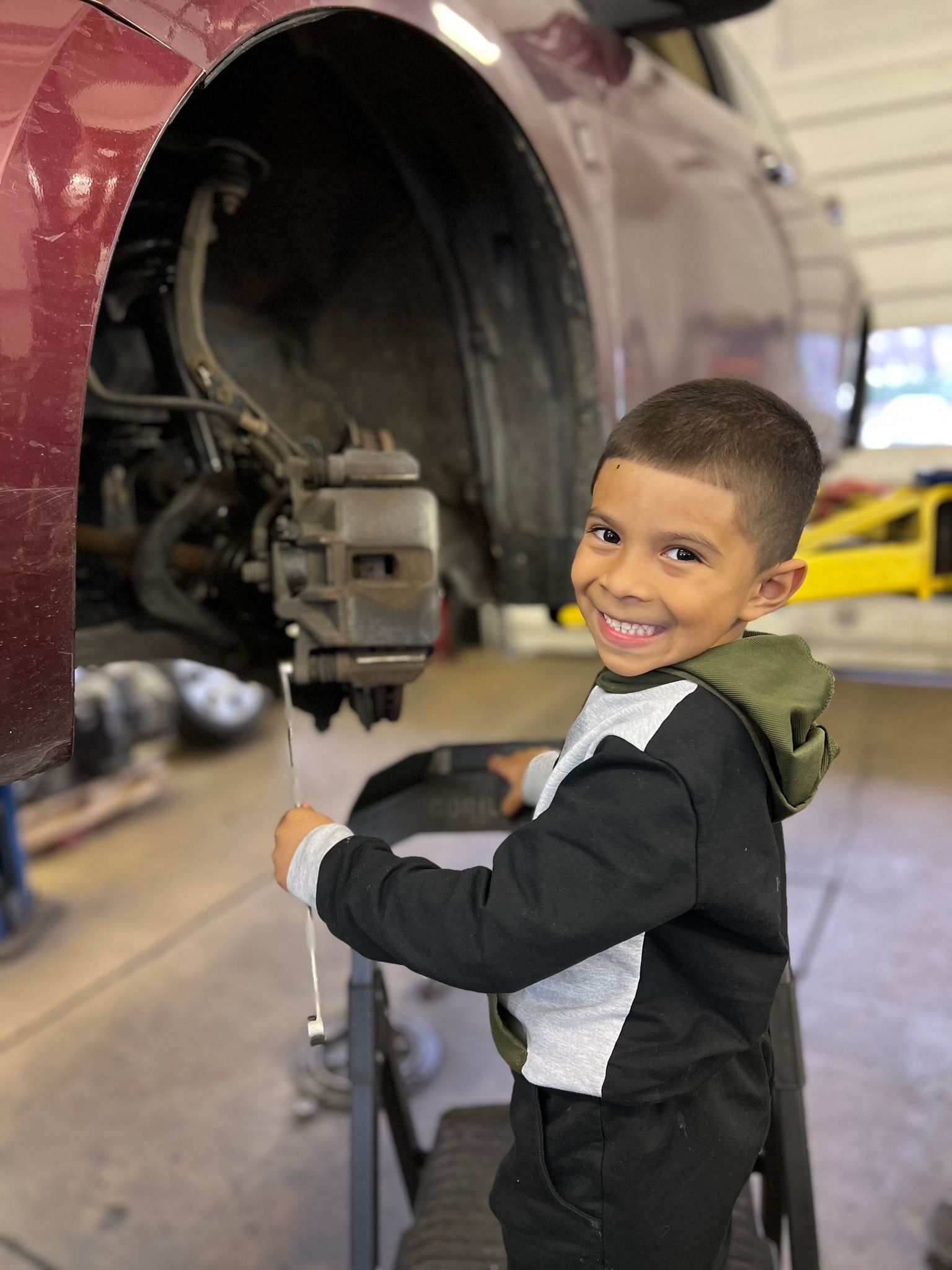 Child in auto shop | The Car Doctor