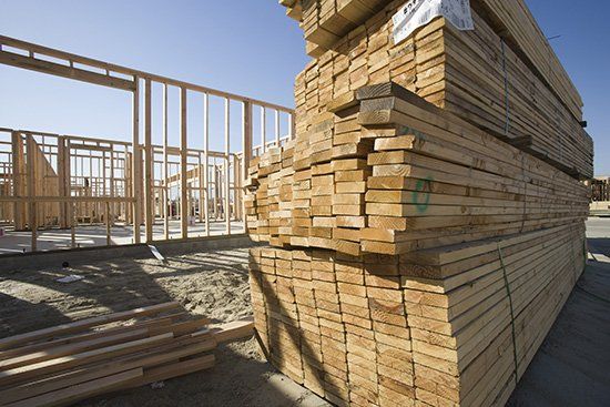 House construction and stack of planks - Lumber Yard in Peoria, IL