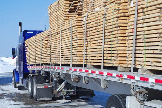 Wood transportation construction planks stack cargo - Lumber Contractor in Peoria, IL