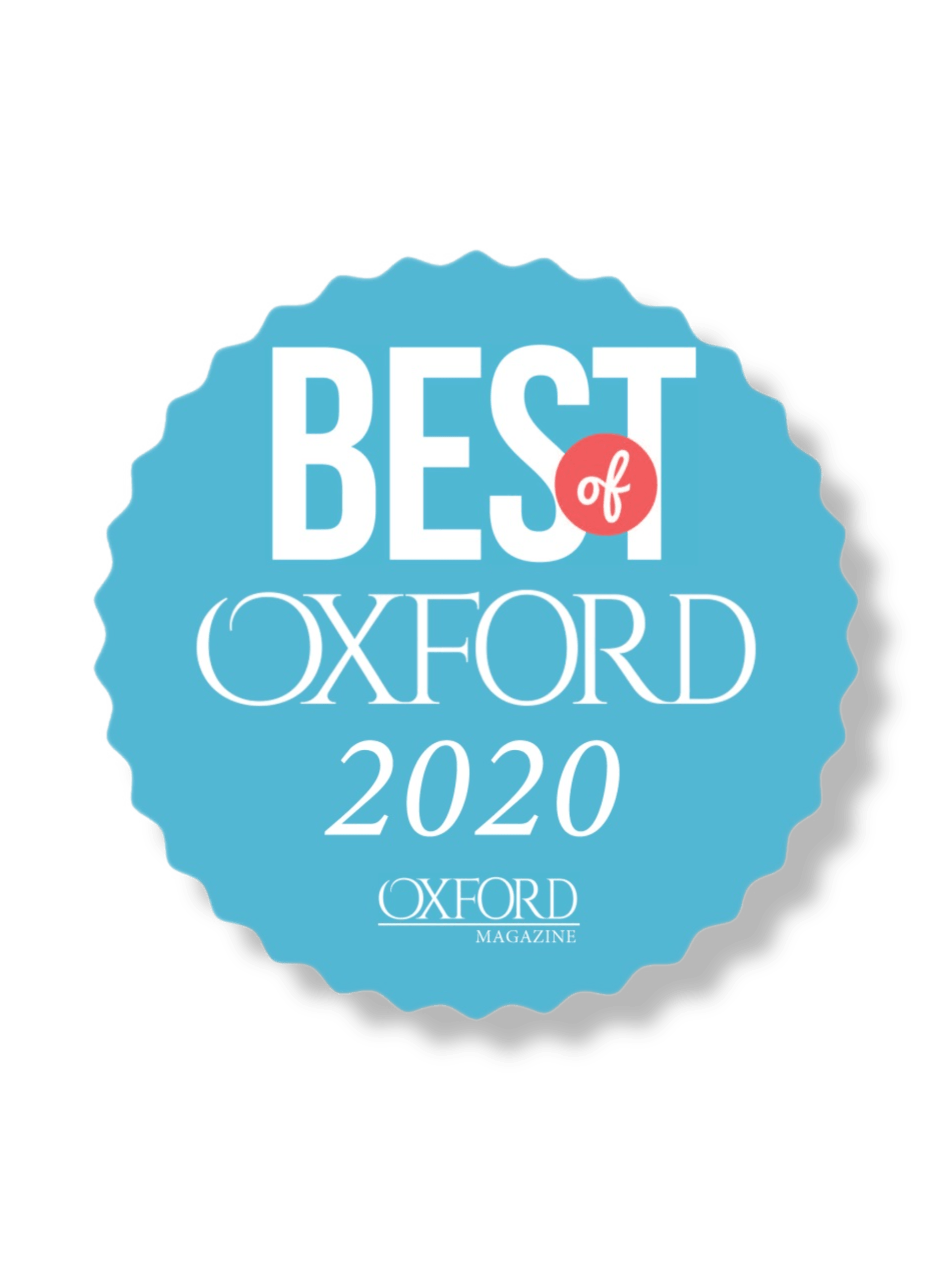 A blue, scalloped-edge badge reading