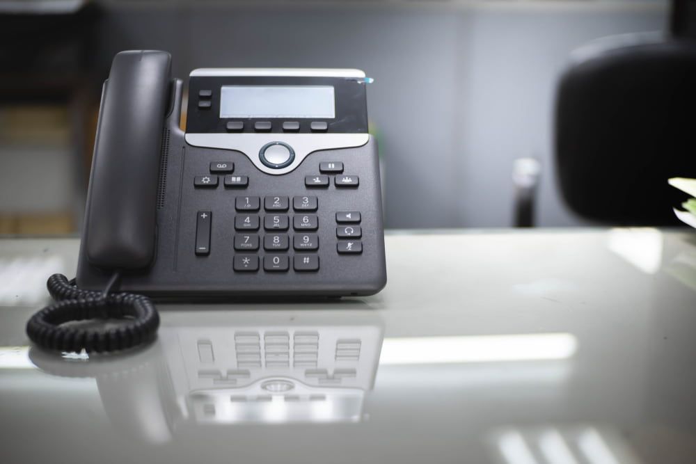 A Telephone Is Sitting On A Desk In An Office — ActiveCo.IT in Forster, NSW
