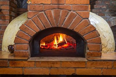 Chimney Cleaning — Fireplace with Fire Burning in Wasatch Front, UT