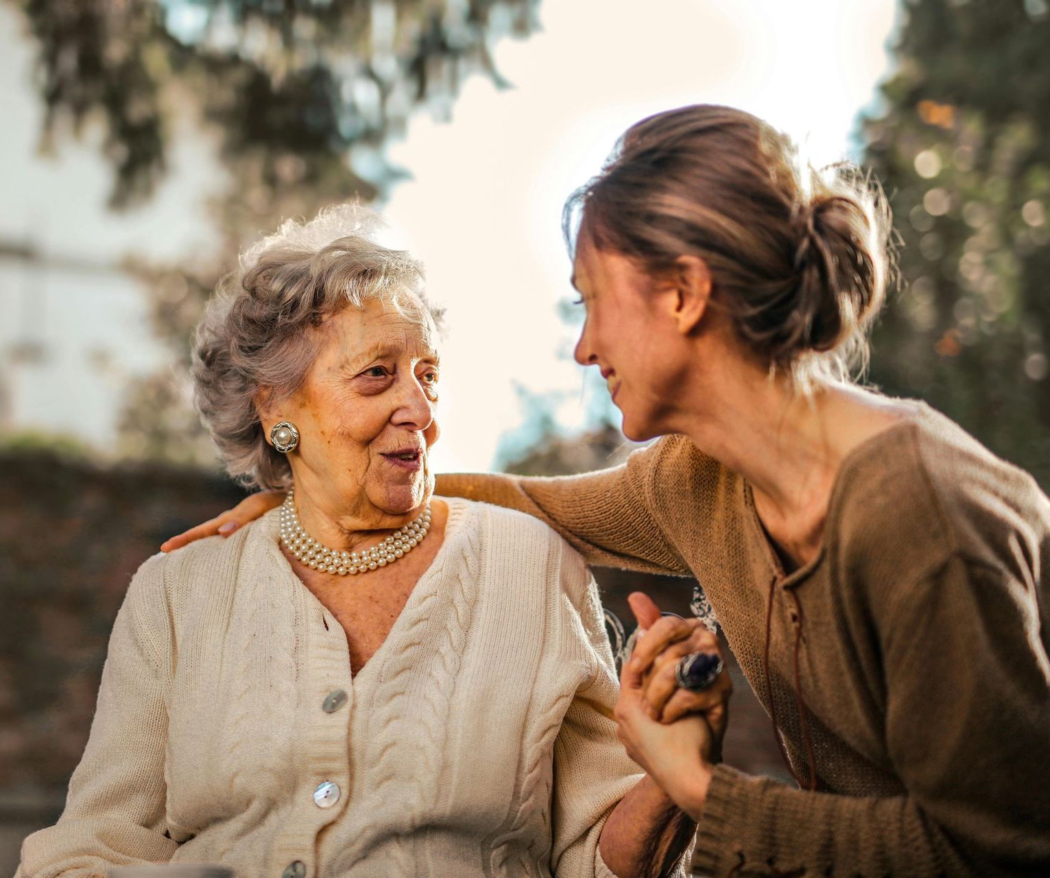 A young woman is talking to an older woman in a wheelchair. Ledbetter Anderson & Associates Law Firm, Houston TX, Estate Planning and Probate Lawyer