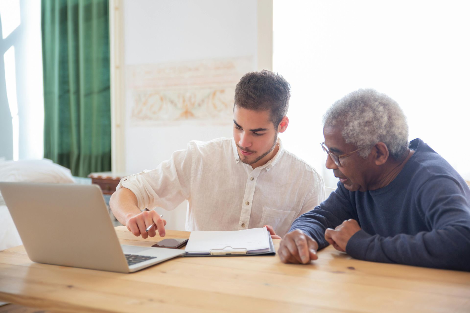 A young man assisting a middle-aged man. Ledbetter Anderson & Associates Law Firm, Houston TX, Estate Planning and Probate 