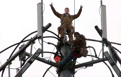 Worker On Top Of Lighting Tower — Austin, TX — LumenServe Inc.