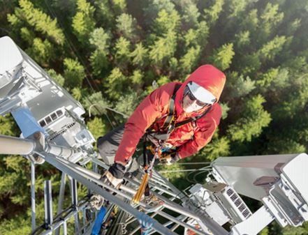 Man Climbing Tower — Austin, TX — LumenServe Inc.