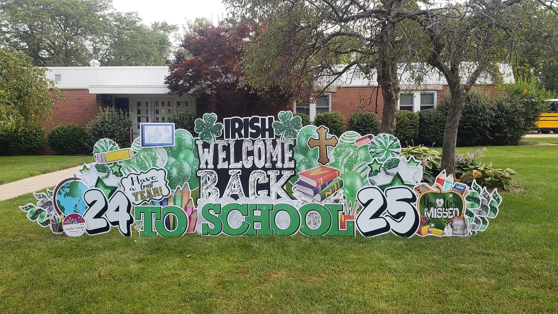 Welcome back sign for school, in green and white with 