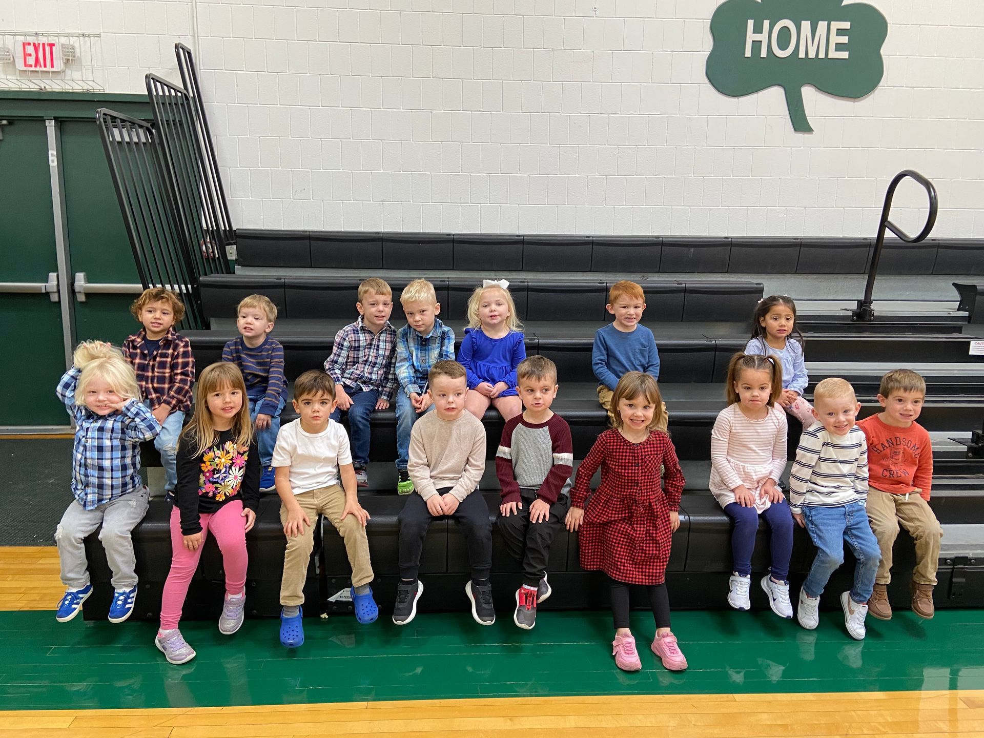 Children on bleachers under a 