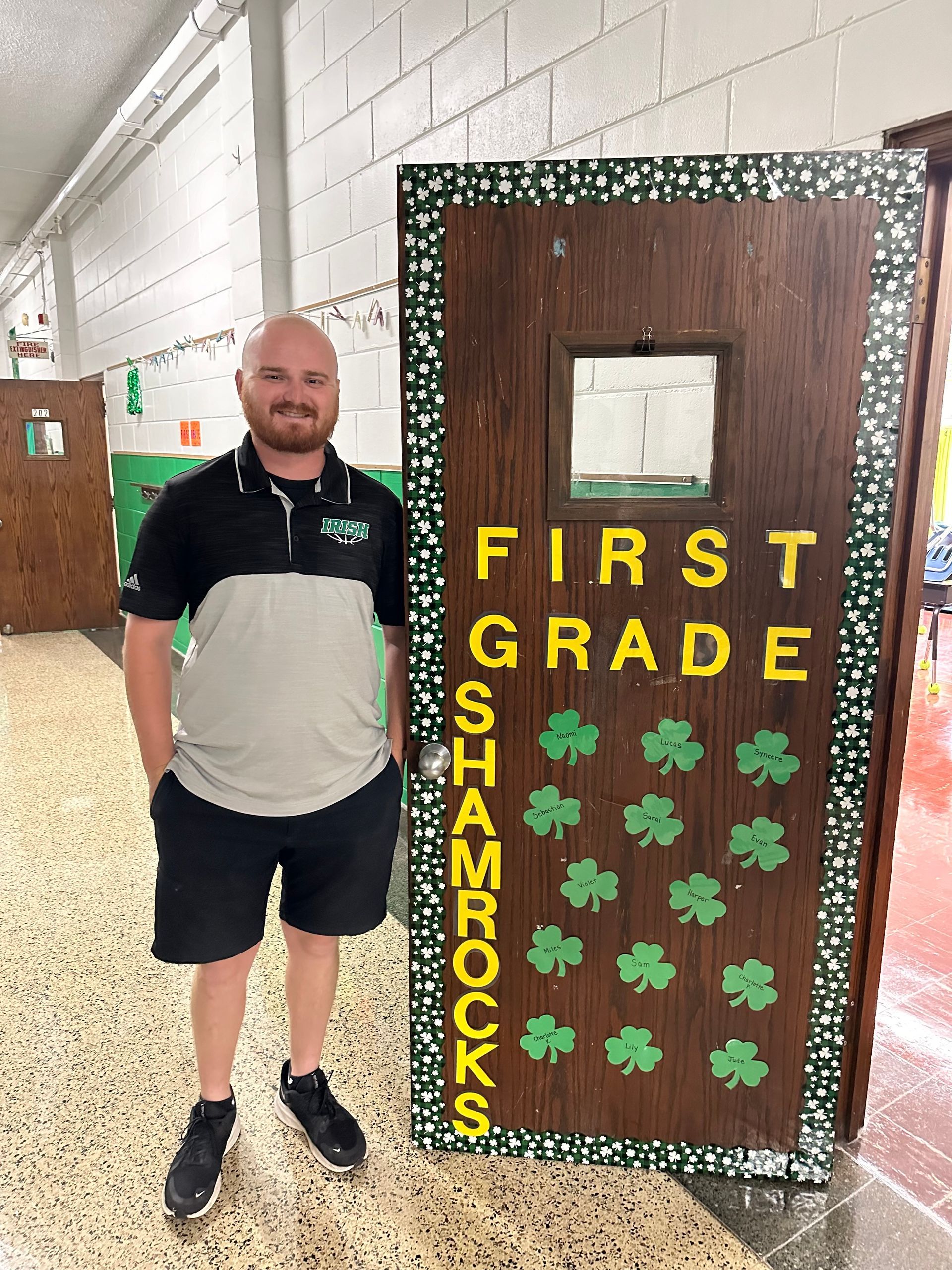 Man stands by a decorated 