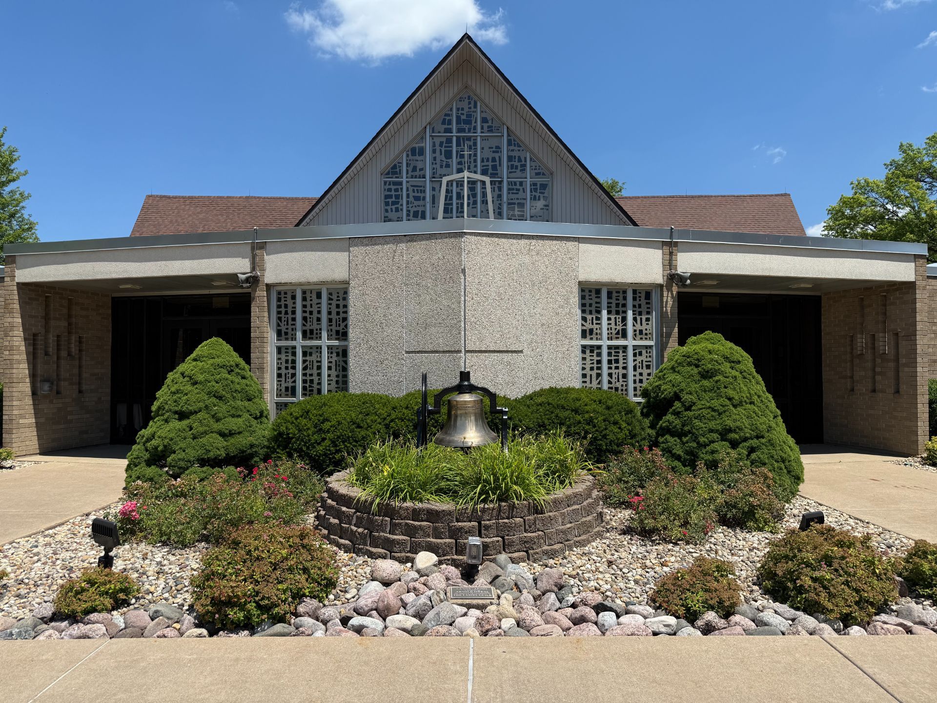 Interior of a church, ornate marble columns and altar beneath a painting.