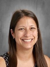 White Celtic knot shamrock on a green background.