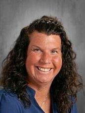 White Celtic knot shamrock on a green background.