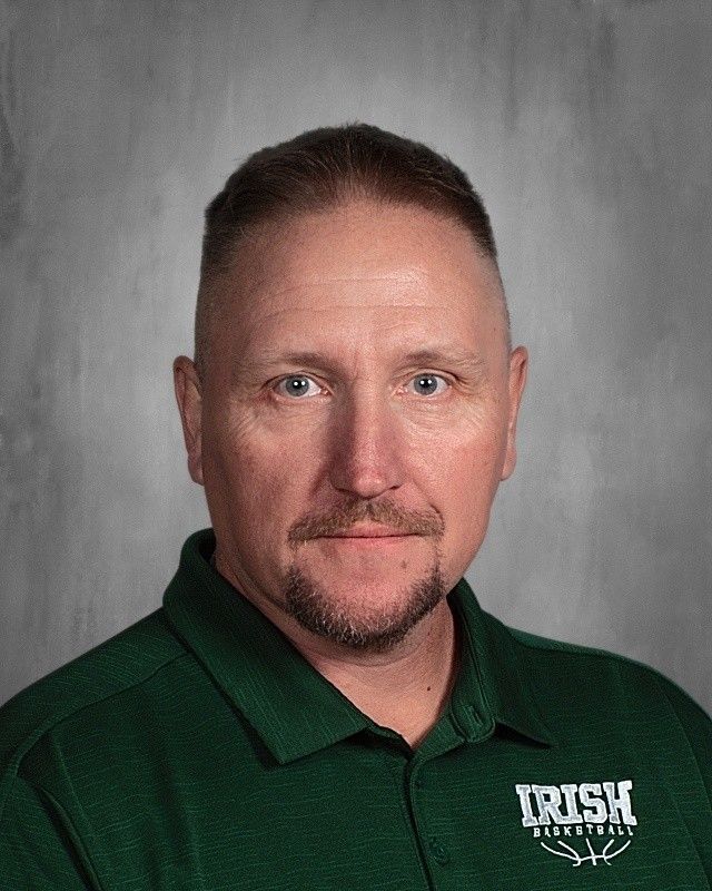 Man in green polo shirt with 