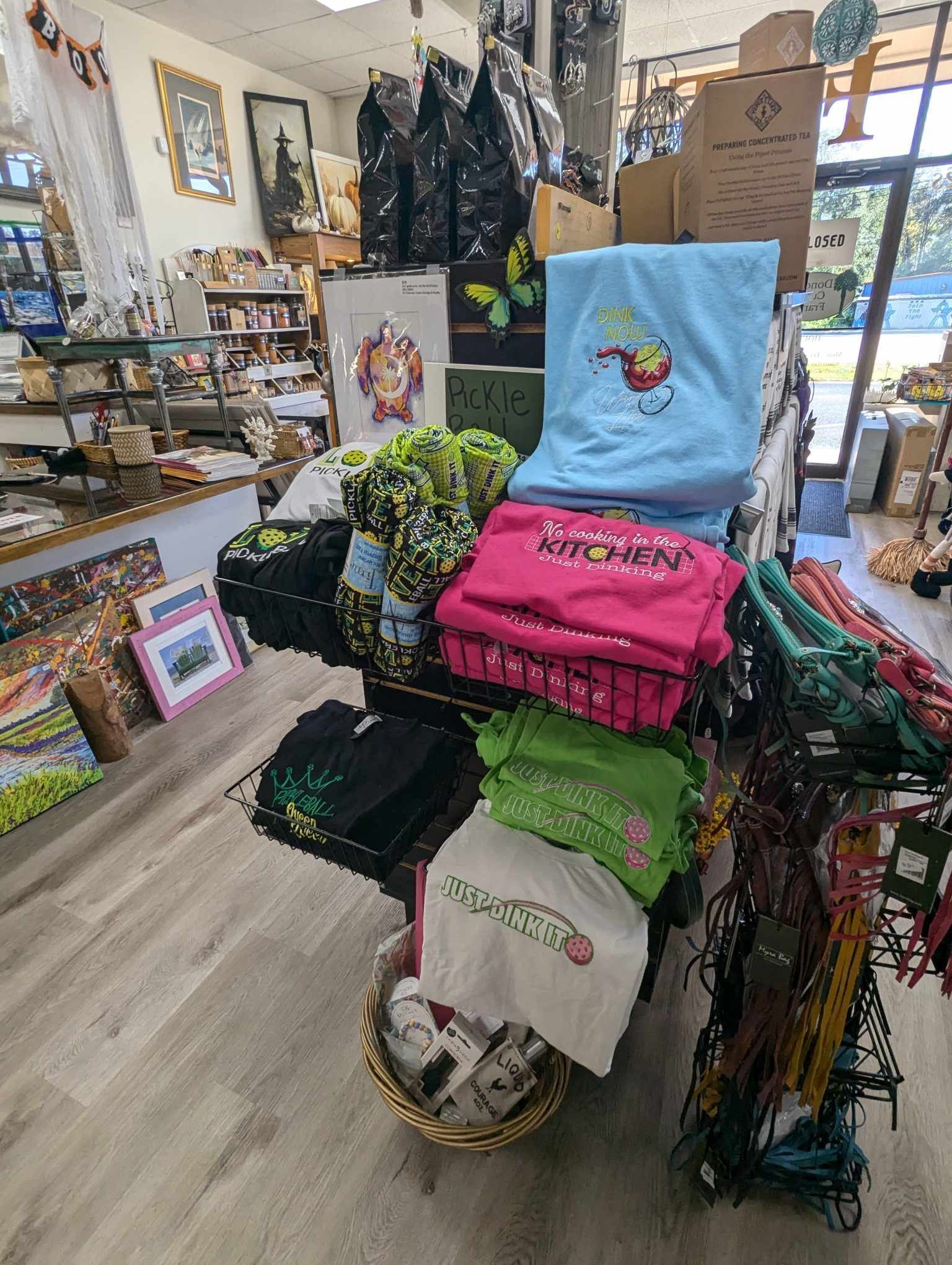 A Store Filled with Lots of Shirts and Other Items — Summerville, SC — Donovan's Custom Framing and Gifts