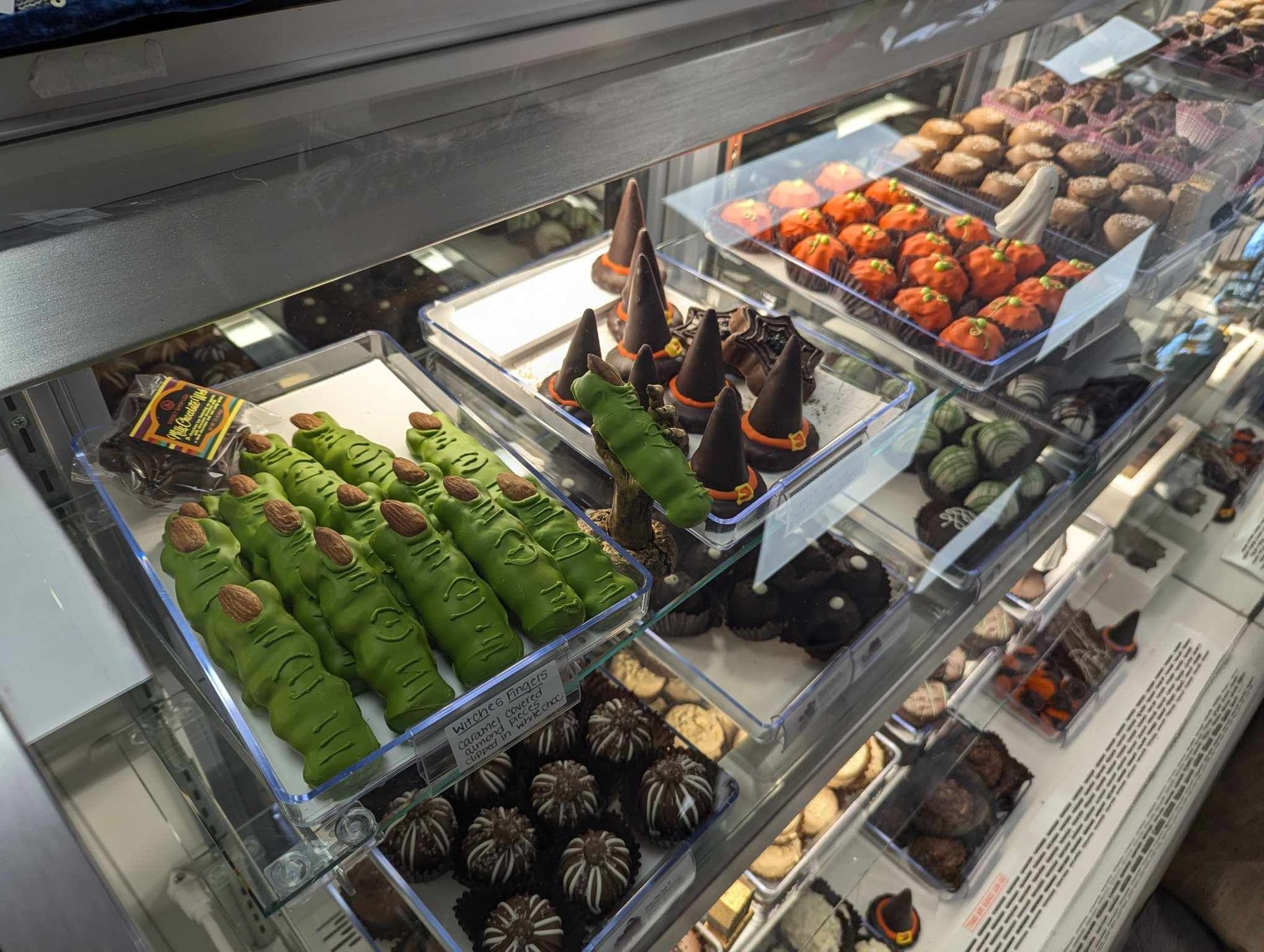 A Display Case Filled with Lots of Different Types of Chocolates — Summerville, SC — Donovan's Custom Framing and Gifts