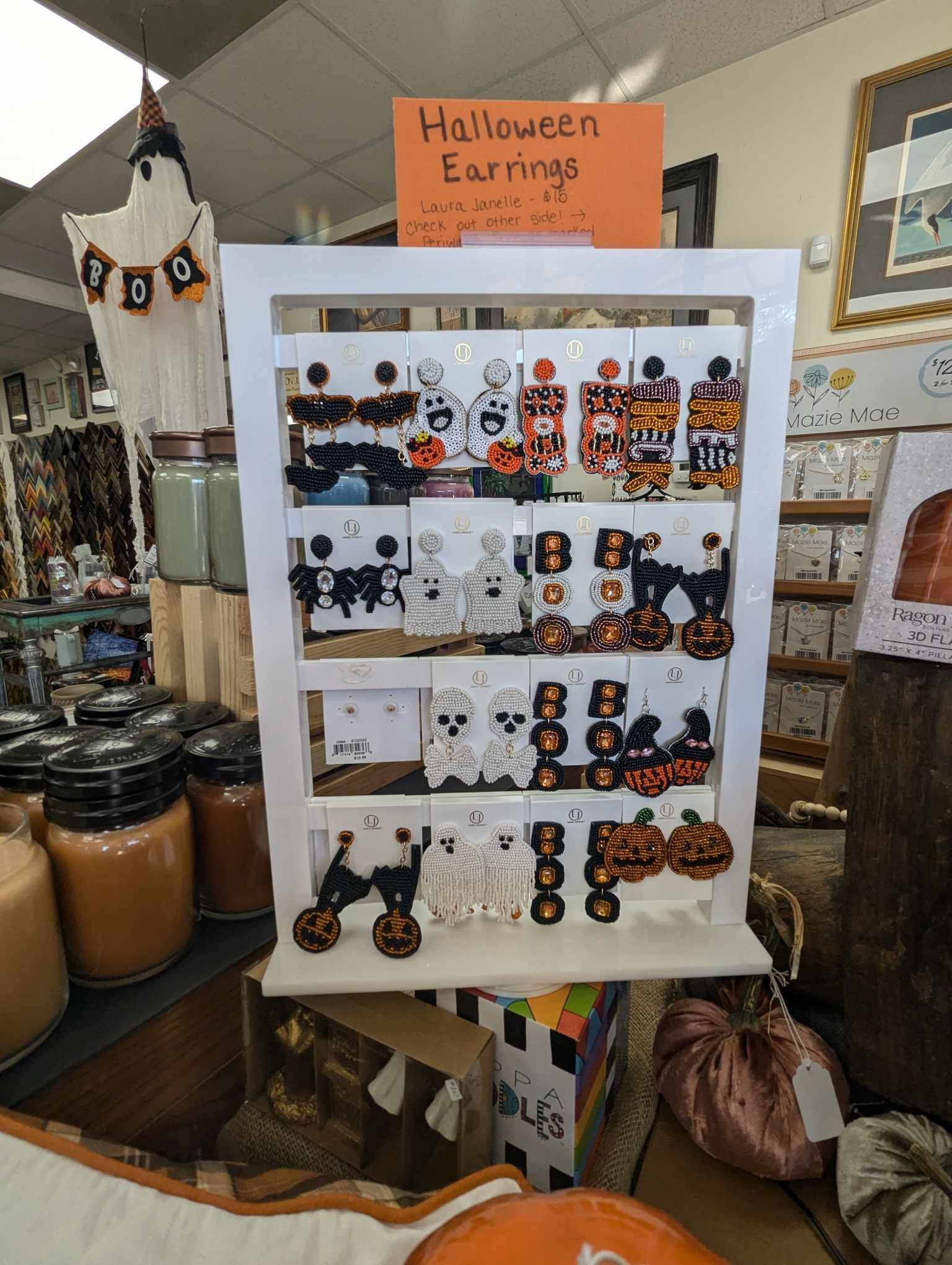White display rack with Halloween earrings for sale.
