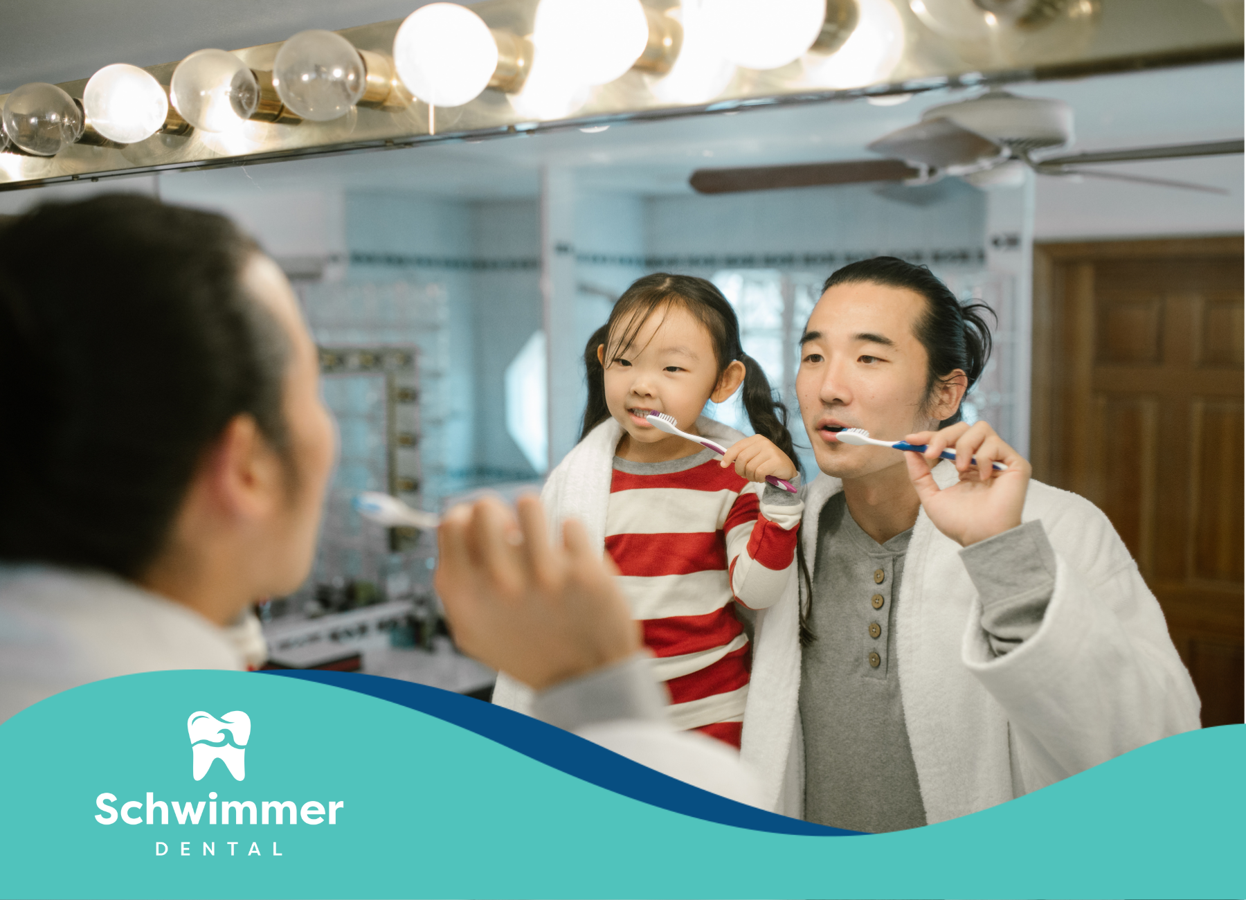 A man and a little girl are brushing their teeth in front of a mirror.