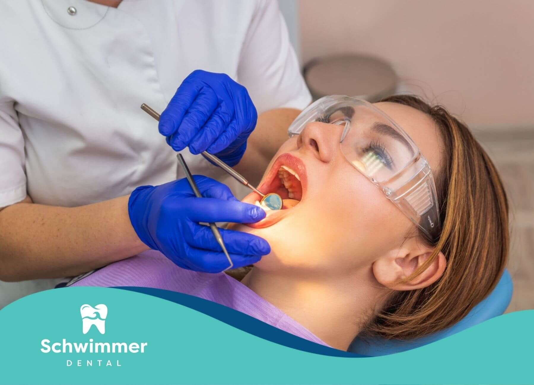 Patient receiving a dental checkup from a dentist.
