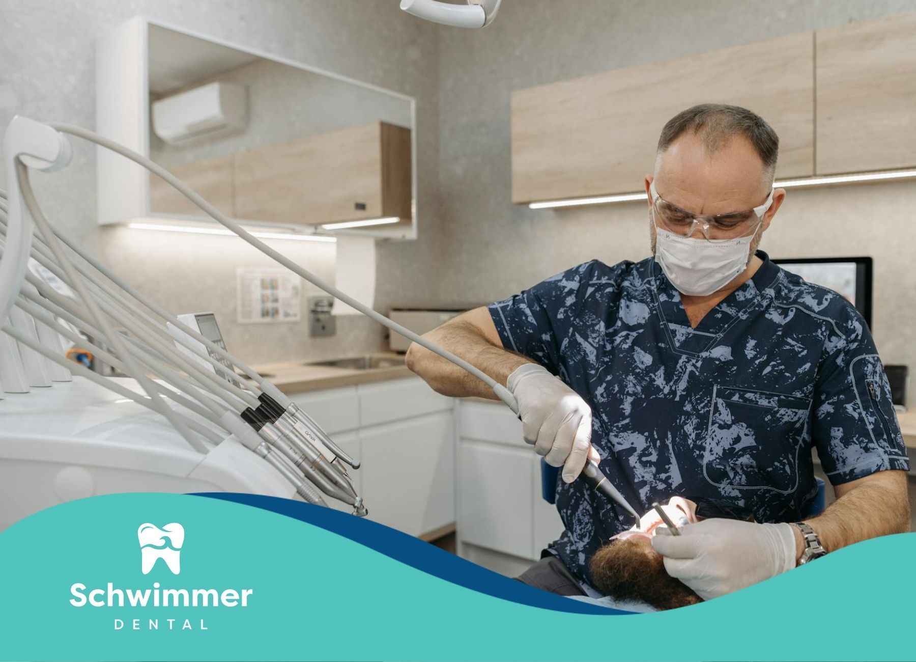 A dentist doing a professional cleaning on a patient at a dental chair in Point Pleasant Beach, NJ.