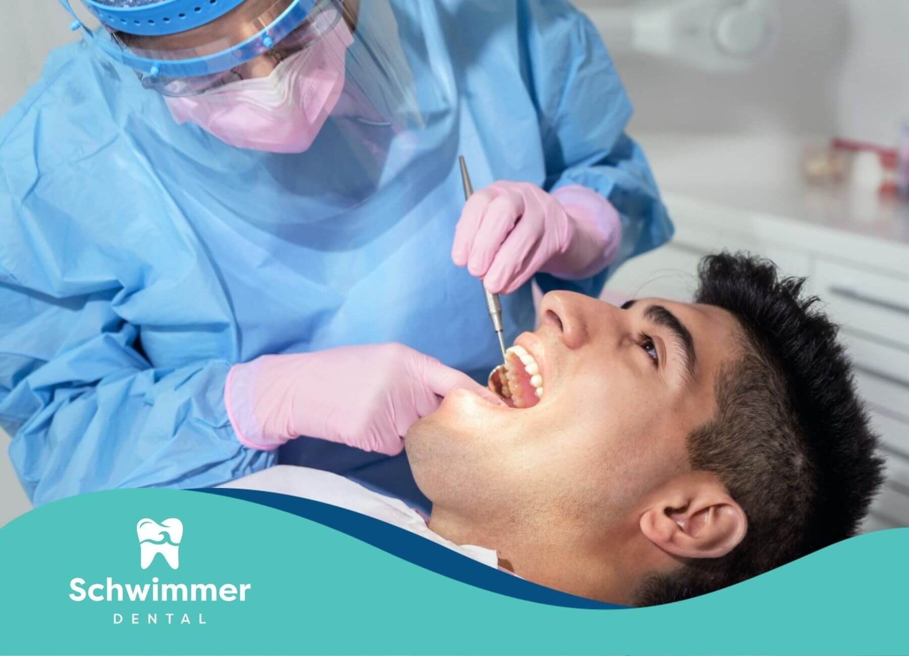 Dentist working on a patient’s mouth.
