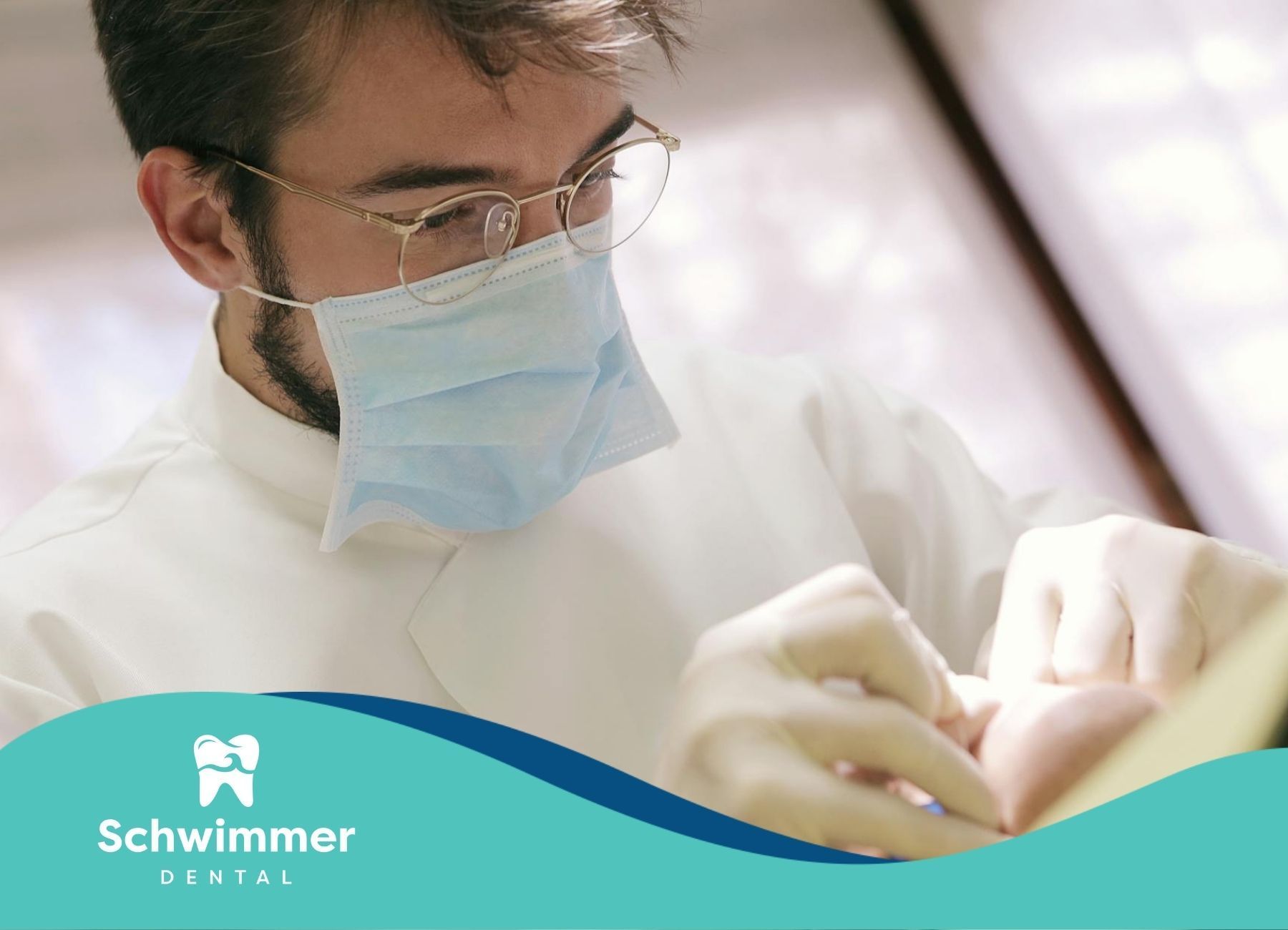 Dentist working on pulling a patient’s tooth with dental tools at a dental clinic in New Jersey.