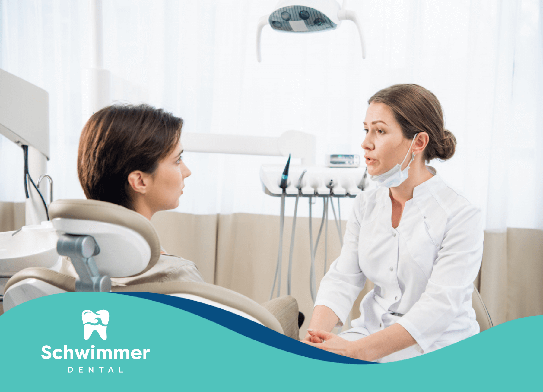 Dentist talking to patient in dental clinic.