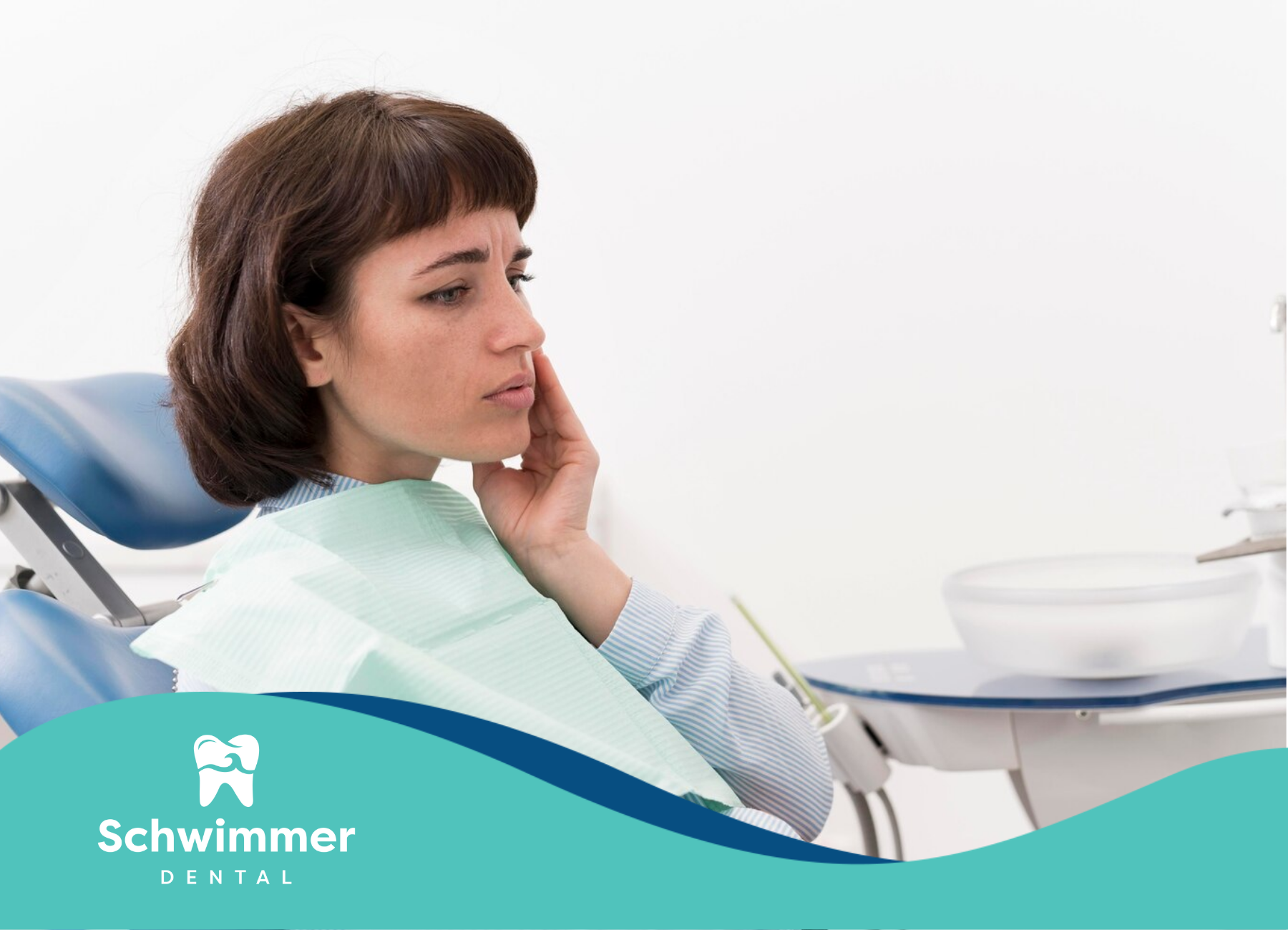 A girl with a dental emergency is sitting on a dentist's chair 