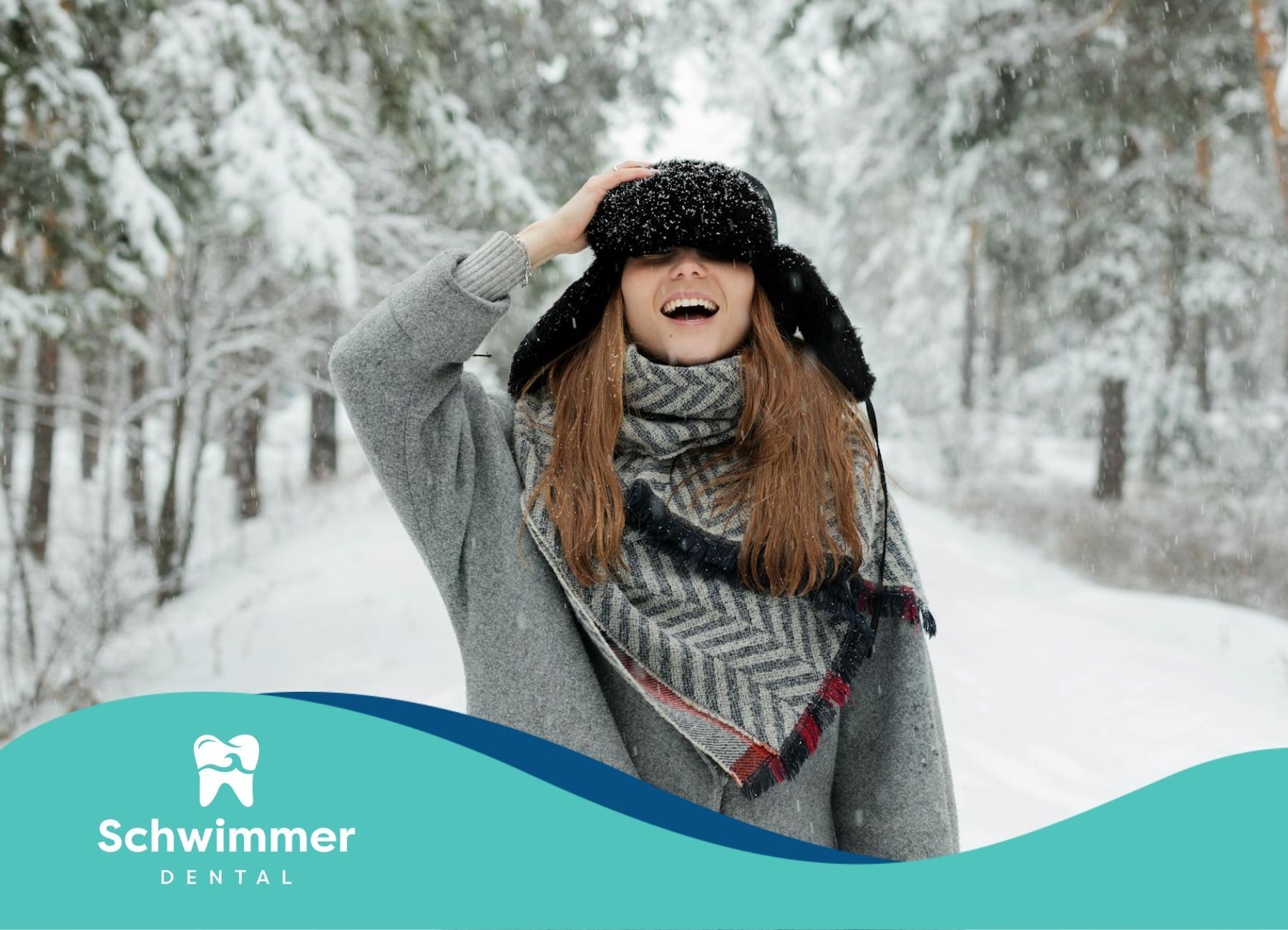 A woman enjoying the snowy outdoors in NJ, with a winter hat and scarf and showing a bright smile.