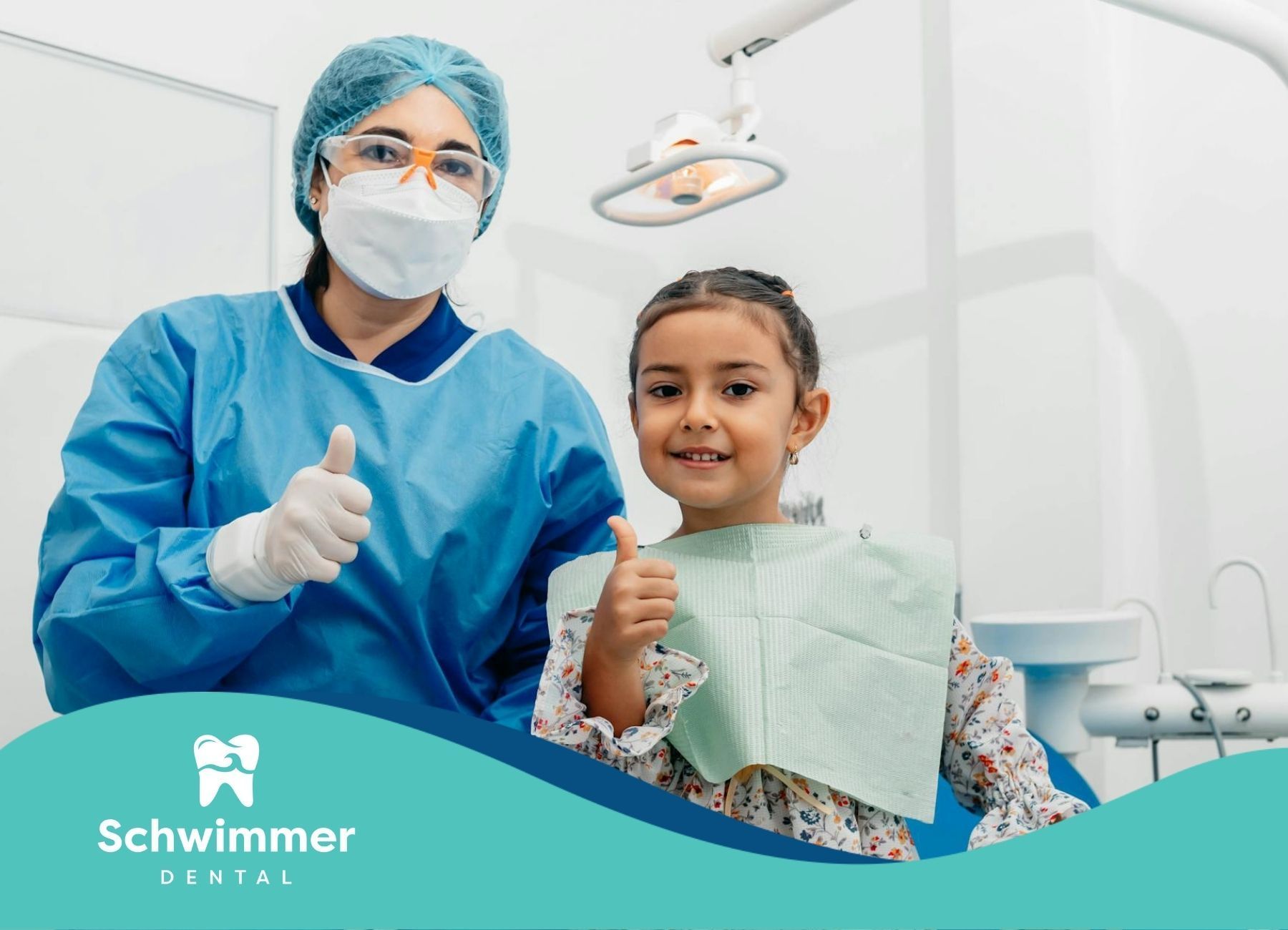 Smiling autistic child with a dentist giving a thumbs up at a dental clinic in Point Pleasant, NJ.