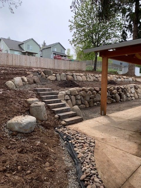 A stone wall with stairs leading up to it