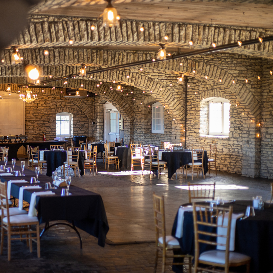 a large room with tables and chairs set up for a party